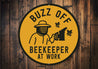 Buzz Off Beekeeper At Work Honeybee Round Sign