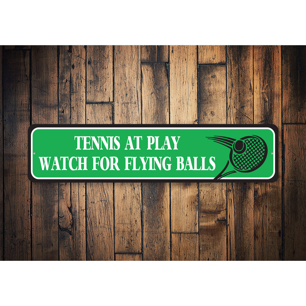 Watch For Flying Tennis Balls Sign