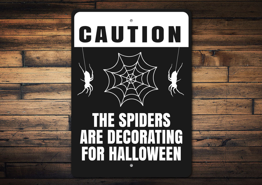 The Spiders Are Decorating For Halloween Sign