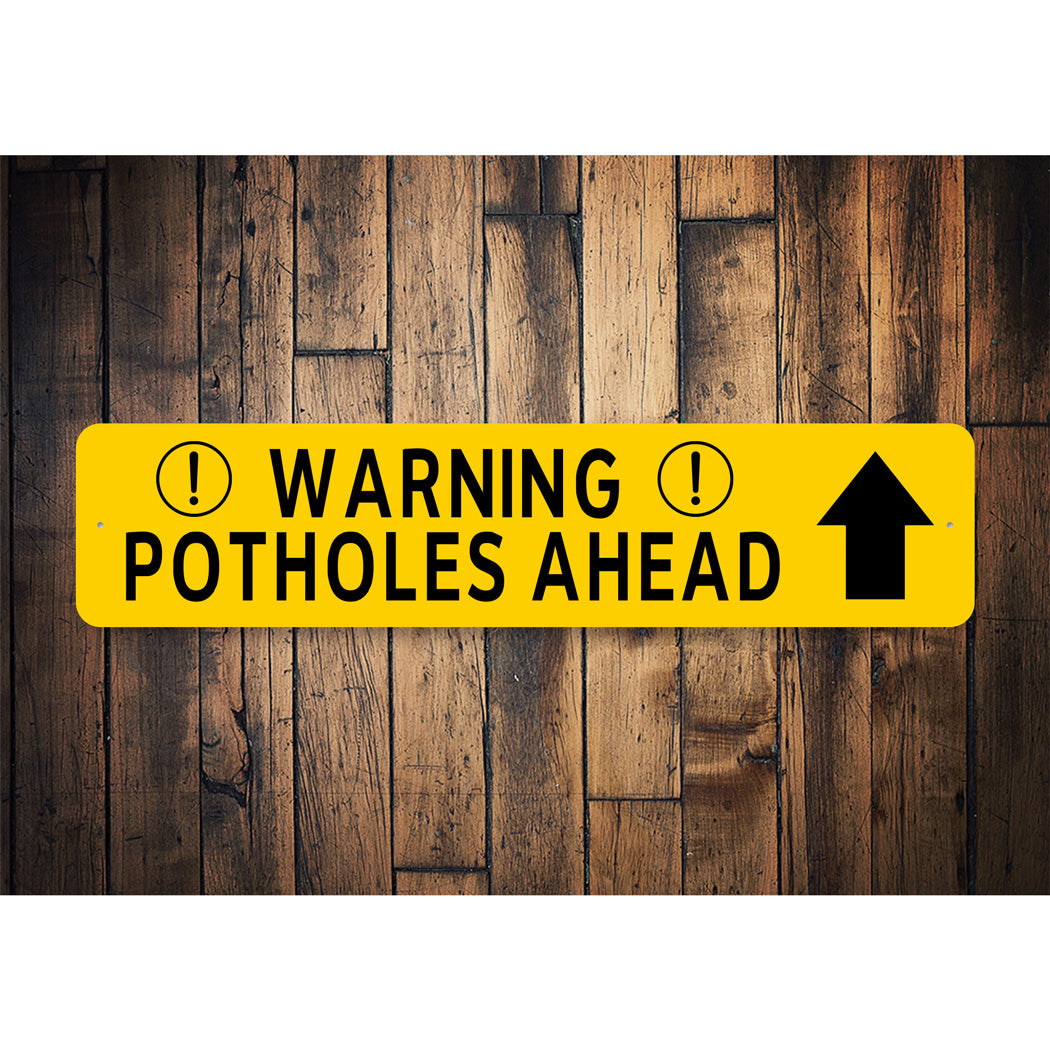 Warning Potholes Ahead Arrow Sign